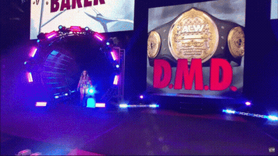 Woman Walking Through Tunnel With DMD Screen GIF