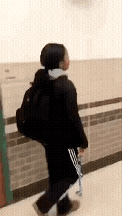 Woman Walking With Backpack And Skateboard GIF