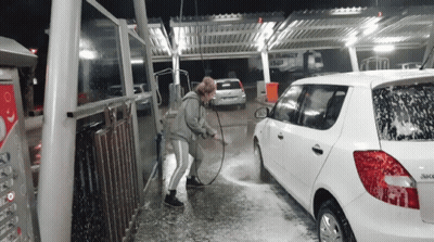 Woman Washing White Car With Hose GIF