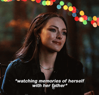Woman Watching Memories Of Herself With Her Father GIF
