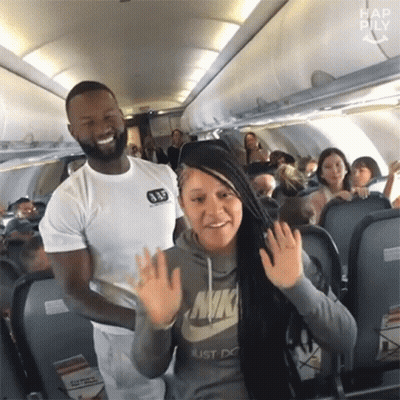 Woman Waving At Man On Airplane GIF