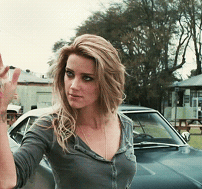 Woman Waving In Front Of Car GIF