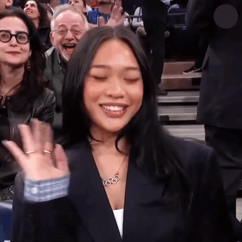 Woman Wearing 3333 Necklace Smiling GIF