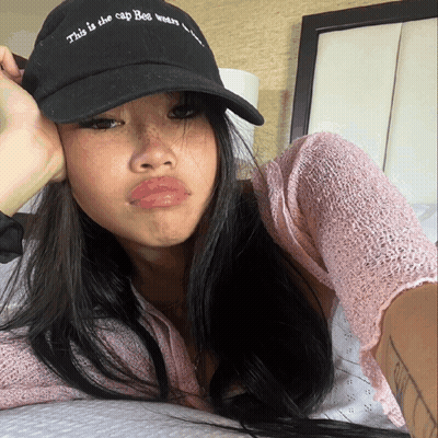 Woman Wearing Black Hat That Says This Is The Cap Bee Wears GIF