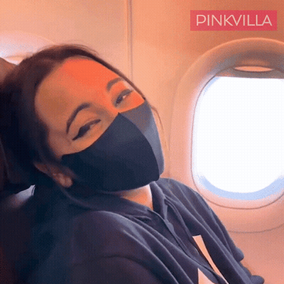 Woman Wearing Black Mask On Plane GIF
