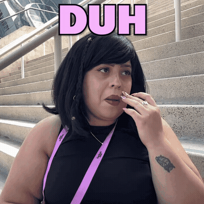 Woman Wearing Black Shirt And Duh Lanyard GIF