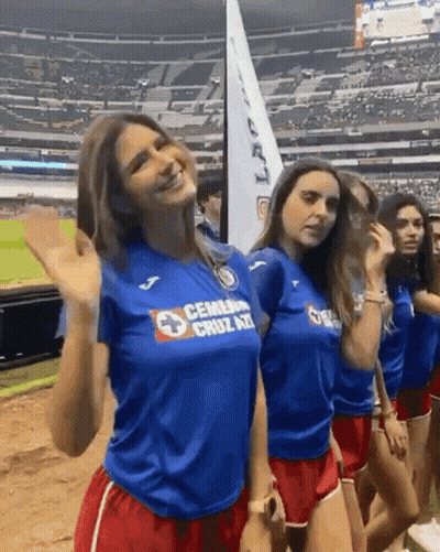 Woman Wearing Blue 'Cemarna Cruz Azul' Shirt GIF