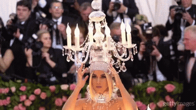 Woman Wearing Chandelier Headpiece GIF