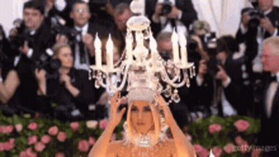 Woman Wearing Chandelier Headpiece GIF