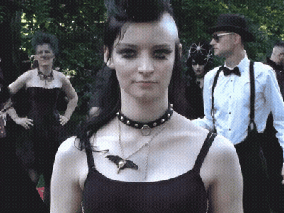 Woman Wearing Choker And Bat Necklace GIF