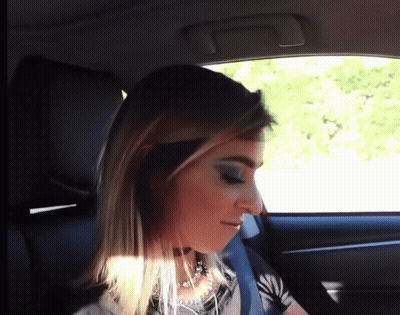 Woman Wearing Choker Looking Out Car Window GIF