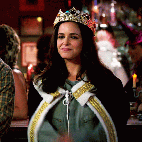 Woman Wearing Crown And Cape Smiling GIF