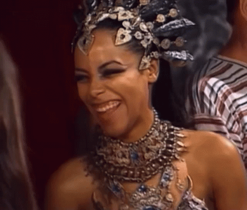 Woman Wearing Crown and Necklace Smiling