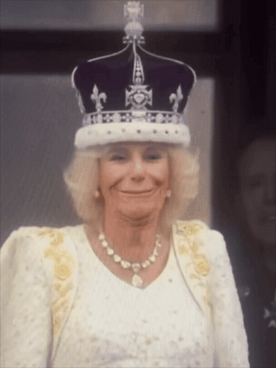 Woman Wearing Crown And Pearl Necklace Smiling GIF