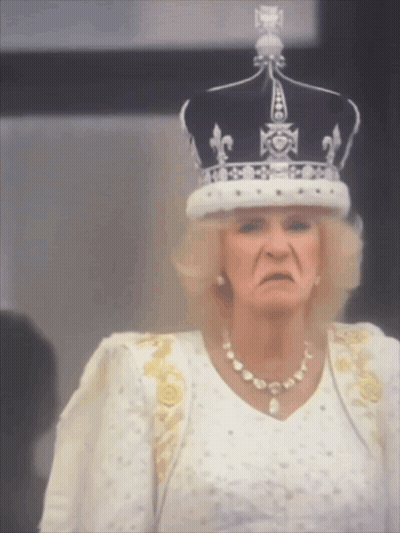 Woman Wearing Crown And White Dress Making Funny Face GIF