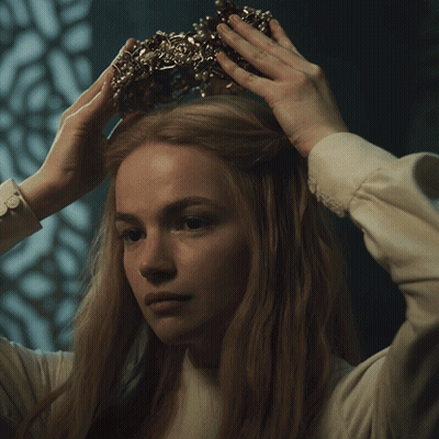 Woman Wearing Crown Looking At Camera GIF
