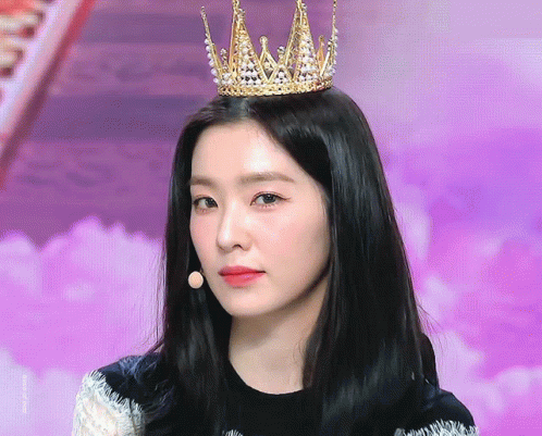 Woman Wearing Crown With Pearls Looking At Camera GIF