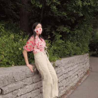 Woman Wearing Face Mask Leaning GIF