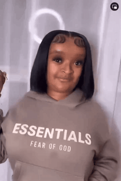 Woman Wearing Fear Of God Essentials Hoodie GIF