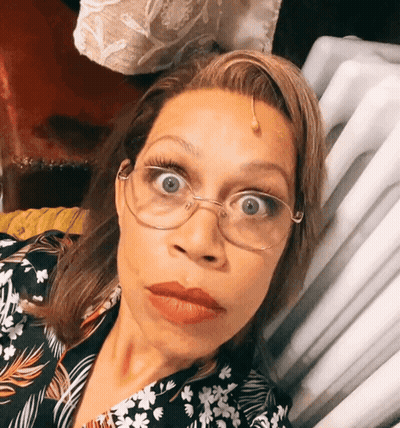 Woman Wearing Glasses And Floral Shirt GIF
