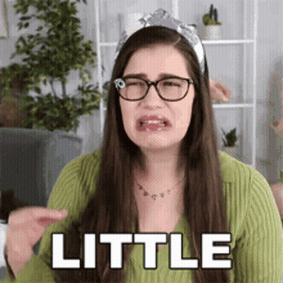 Woman Wearing Glasses And Headband Making Funny Face GIF