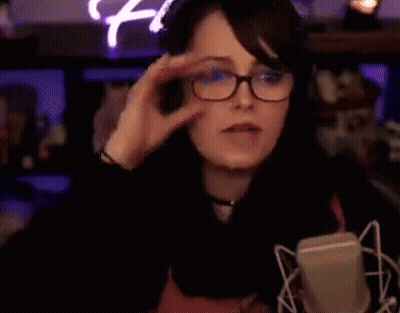 Woman Wearing Glasses And Headphones Pointing GIF