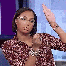 Woman Wearing Glasses And Leopard Shirt Making Funny Face GIF