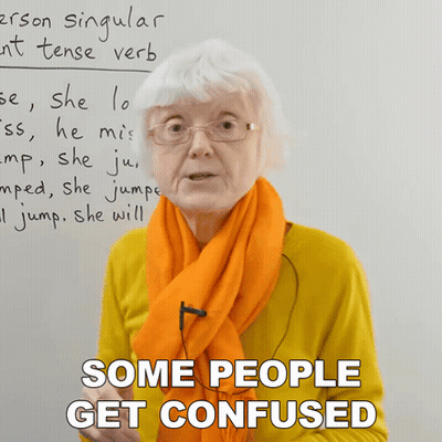 Woman Wearing Glasses And Orange Scarf Says Some People Get Confused GIF