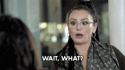 Woman Wearing Glasses And Scarf Saying Wait What GIF