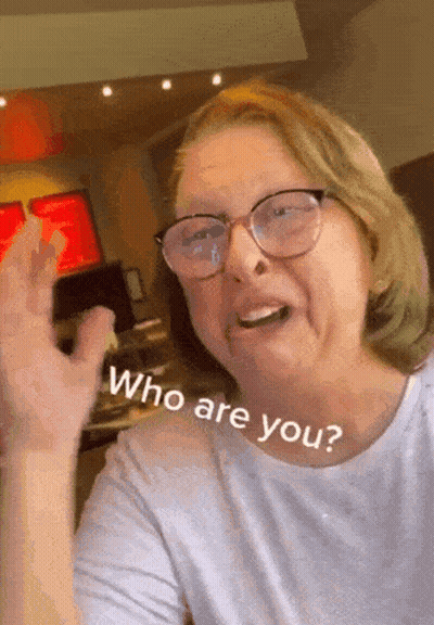 Woman Wearing Glasses Asking Who Are You GIF