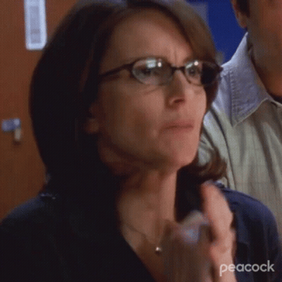 Woman Wearing Glasses Clapping Hands In Front Of Man GIF