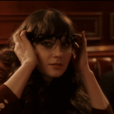 Woman Wearing Glasses Covering Ears GIF