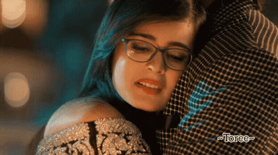 Woman Wearing Glasses Hugged By Man With Torce GIF