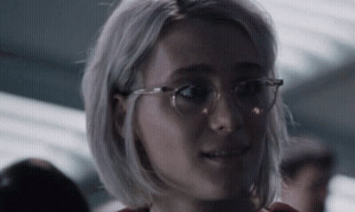 Woman Wearing Glasses Looking At Camera GIF