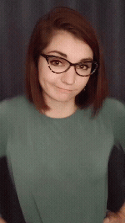 Woman Wearing Glasses Making Funny Face GIF