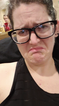 Woman Wearing Glasses Making Funny Face GIF