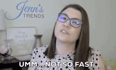 Woman Wearing Glasses Making Funny Face Saying Not So Fast GIF