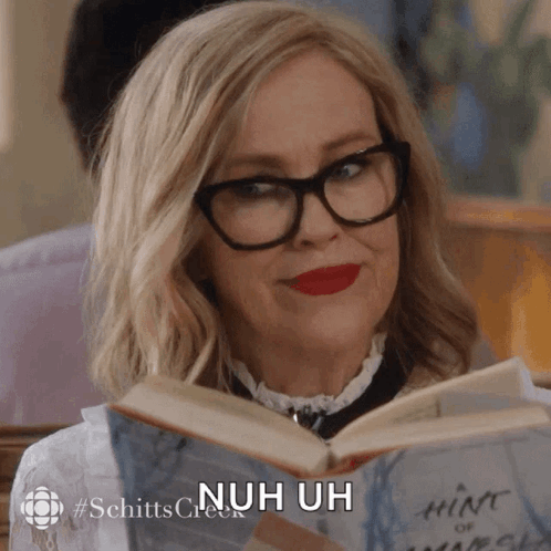 Woman Wearing Glasses Reading Book Nuh Uh GIF