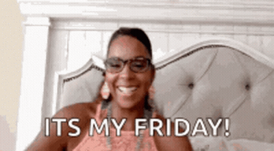 Woman Wearing Glasses Smiling In Bed GIF