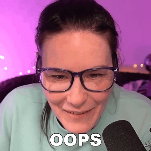 Woman Wearing Glasses Smiling Says Oops GIF