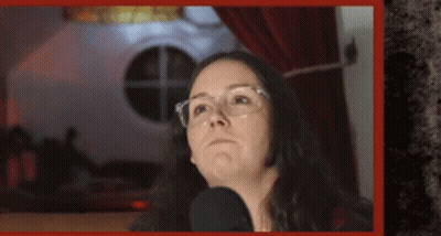 Woman Wearing Glasses Talking Into Microphone GIF