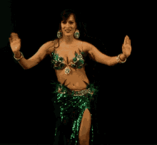 Woman Wearing Green Attire Doing Belly Dance