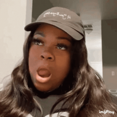 Woman Wearing Hat Making Funny Face GIF