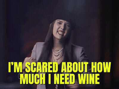 Woman Wearing Hat Saying I'm Scared About Wine GIF