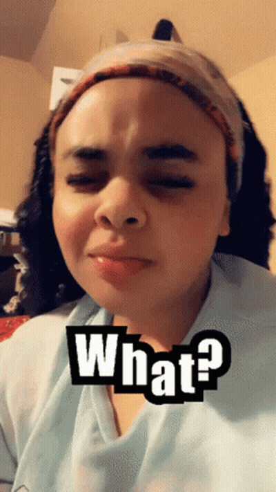 Woman Wearing Headband And Blue Shirt Saying What GIF