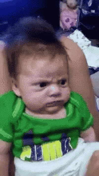 Woman Wearing Headband And Blue Shirt Saying What GIF
