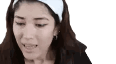 Woman Wearing Headband And Earrings Making Face Sticker