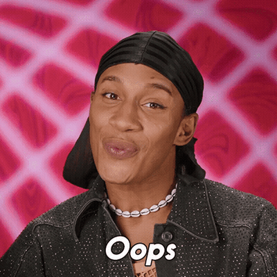 Woman Wearing Headband And Oops Necklace GIF