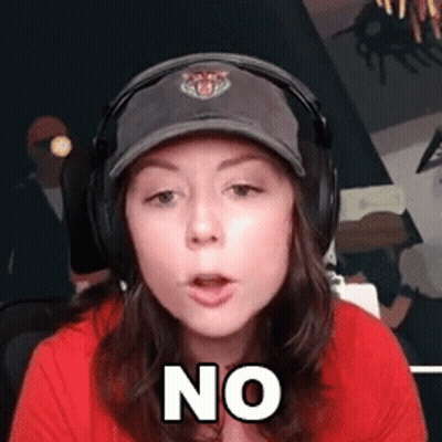 Woman Wearing Headphones And Baseball Cap Making No Sign GIF