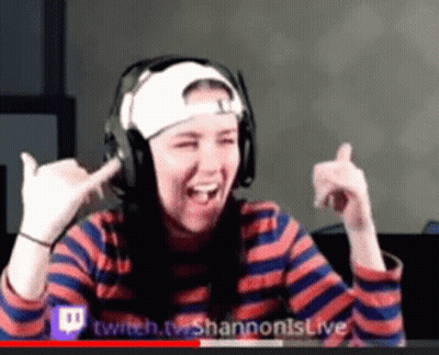 Woman Wearing Headphones And Hat Making Funny Face GIF